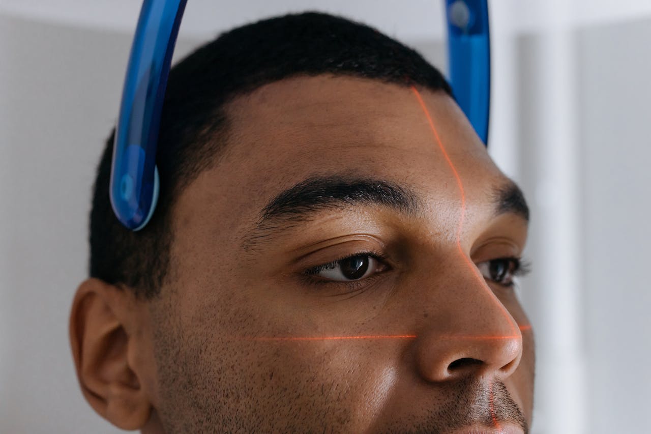 Patient positioned in a CBCT dental CT scanner with laser alignment beams — 3D imaging used for precision implant planning at top Turkish dental clinics